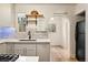 Well-lit kitchen featuring white countertops, stainless steel appliances, and subway tile backsplash at 521 Harrison St, Denver, CO 80206