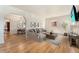 Bright living room with hardwood floors, a large sofa and view of adjacent dining room at 521 Harrison St, Denver, CO 80206