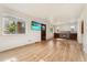 Bright living room with hardwood floors, fireplace, and large windows providing natural light at 521 Harrison St, Denver, CO 80206