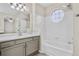 Bathroom with bathtub shower and updated vanity at 4072 S Kirk Way, Aurora, CO 80013