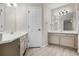 Updated bathroom with double vanity and new flooring at 4072 S Kirk Way, Aurora, CO 80013