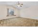 Spacious bedroom with large window and ceiling fan at 4072 S Kirk Way, Aurora, CO 80013