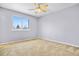 Bright bedroom with window and ceiling fan at 4072 S Kirk Way, Aurora, CO 80013