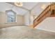 Spacious living room with vaulted ceiling, hardwood floors, and a staircase at 4072 S Kirk Way, Aurora, CO 80013