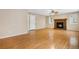 Living area with hardwood floors, fireplace and adjacent door at 4072 S Kirk Way, Aurora, CO 80013