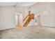 Bright living room with vaulted ceiling, hardwood floors, and a staircase at 4072 S Kirk Way, Aurora, CO 80013