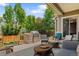 Outdoor kitchen with built-in grill and patio area, great for entertaining at 10182 Bristleridge St, Parker, CO 80134