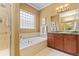 Bright bathroom with soaking tub, separate shower, and plenty of natural light at 10182 Bristleridge St, Parker, CO 80134