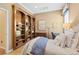 Serene bedroom featuring a custom wood bookshelf, a desk, and a comfortable bed at 10182 Bristleridge St, Parker, CO 80134