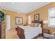 Inviting bedroom with tray ceilings, ample natural light, and stylish decor at 10182 Bristleridge St, Parker, CO 80134