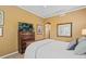 Comfortable bedroom includes an entertainment center and generous space at 10182 Bristleridge St, Parker, CO 80134