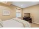 Bedroom featuring a cozy window, television, and neutral tones at 10182 Bristleridge St, Parker, CO 80134