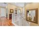 Elegant foyer with hardwood floors, staircase and views to dining and living areas at 10182 Bristleridge St, Parker, CO 80134
