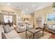 Spacious living room showcasing an open layout, hardwood floors, and views to the dining area at 10182 Bristleridge St, Parker, CO 80134