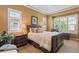 Cozy main bedroom with natural light, tray ceilings and comfortable furnishings at 10182 Bristleridge St, Parker, CO 80134