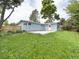 View of the spacious, grassy backyard and concrete patio at 10025 W 8Th Ave, Lakewood, CO 80215