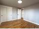 Spacious bedroom features hardwood floors, closet, and fresh paint at 10025 W 8Th Ave, Lakewood, CO 80215