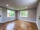A bright bedroom with hardwood floors and two large windows at 10025 W 8Th Ave, Lakewood, CO 80215