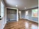 Bright living room features beautiful wood floors and natural light with laundry hookups at 10025 W 8Th Ave, Lakewood, CO 80215