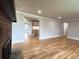 Open-concept living room leading into the kitchen, complete with beautiful hardwood flooring at 10025 W 8Th Ave, Lakewood, CO 80215