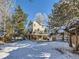 Large backyard with snowy landscape and home view at 4737 N Bearlily Way, Castle Rock, CO 80109