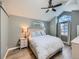 Main bedroom with vaulted ceiling, ceiling fan, and hardwood floors at 4737 N Bearlily Way, Castle Rock, CO 80109