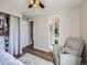 Cozy bedroom with built-in shelving and adjacent bathroom at 4737 N Bearlily Way, Castle Rock, CO 80109