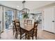 Bright dining room with wooden table and access to a deck at 4737 N Bearlily Way, Castle Rock, CO 80109