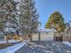 Two-story house with attached garage and snow-covered driveway at 4737 N Bearlily Way, Castle Rock, CO 80109