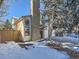 Two story home with attached garage and snowy yard at 4737 N Bearlily Way, Castle Rock, CO 80109