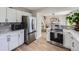 Modern kitchen with stainless steel appliances and white cabinets at 4737 N Bearlily Way, Castle Rock, CO 80109