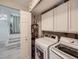 Convenient laundry room with washer, dryer, and storage at 4737 N Bearlily Way, Castle Rock, CO 80109