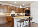 Updated kitchen features granite countertops, stainless steel appliances, and a breakfast bar with seating at 7367 S Pennsylvania St, Littleton, CO 80122