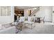 Open-concept living area with modern furnishings, a cozy atmosphere, and seamless flow to the dining area at 7367 S Pennsylvania St, Littleton, CO 80122
