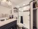 Modern bathroom featuring a glass shower and a white vanity with a black countertop at 9150 Garrison St, Broomfield, CO 80021