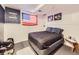 Bedroom featuring a black bed with dark gray carpet and an American Flag hanging on the wall at 9150 Garrison St, Broomfield, CO 80021