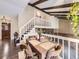Dining area with a wooden table and chairs, showcasing exposed beams and a staircase at 9150 Garrison St, Broomfield, CO 80021