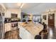 Kitchen featuring a large island with seating, stainless steel appliances, and hardwood floors at 9150 Garrison St, Broomfield, CO 80021