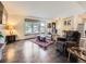 Bright living room with hardwood floors, a large window, and comfortable seating area at 9150 Garrison St, Broomfield, CO 80021