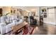 Spacious living room featuring hardwood floors, a comfortable sofa set, and an open floor plan at 9150 Garrison St, Broomfield, CO 80021