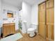 Bathroom featuring a white toilet, a shower with patterned curtains, and a wood vanity at 22155 Cook Ln, Morrison, CO 80465