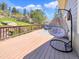 Spacious outdoor deck with a hanging chair and scenic views, perfect for relaxation and enjoying the outdoors at 22155 Cook Ln, Morrison, CO 80465