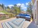 Outdoor deck featuring comfortable seating and scenic views, perfect for relaxing and enjoying the natural surroundings at 22155 Cook Ln, Morrison, CO 80465