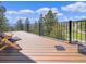 Inviting deck featuring views, modern railing, and comfortable seating, ideal for outdoor relaxation and entertaining at 22155 Cook Ln, Morrison, CO 80465