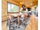 Inviting dining area adjacent to kitchen, featuring modern table setting and views at 22155 Cook Ln, Morrison, CO 80465