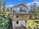 Stunning two-story home featuring a spacious balcony and beautiful natural surroundings at 22155 Cook Ln, Morrison, CO 80465
