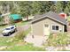 Charming building with a wood deck, set amidst a beautiful landscape, perfect for a serene living at 22155 Cook Ln, Morrison, CO 80465