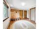Hallway featuring coat rack with built-in bench, two wooden doors, a window, and a round rug at 22155 Cook Ln, Morrison, CO 80465