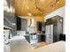 Contemporary kitchen featuring black cabinetry, stainless appliances and stylish lighting at 22155 Cook Ln, Morrison, CO 80465