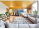 Spacious living area featuring wood ceilings, comfortable furniture, and plenty of natural light at 22155 Cook Ln, Morrison, CO 80465